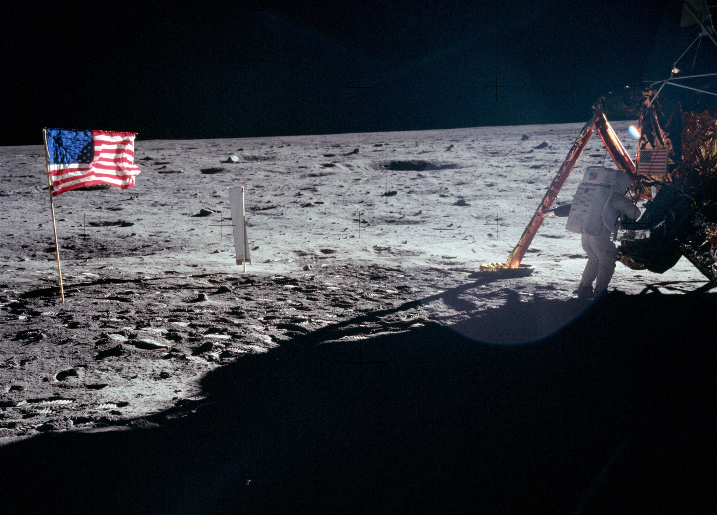 Buzz Aldrin standing on the lunar surface beside the American flag during the Apollo 11 mission in July 1969