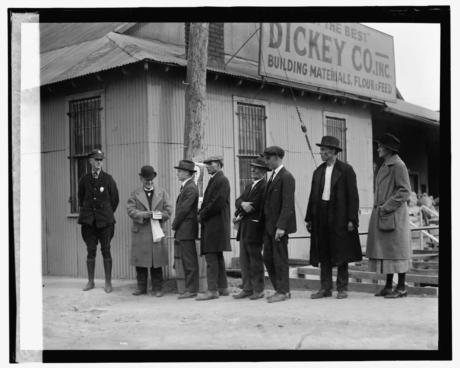 A long line of voters waiting outside a polling place to cast their ballots on Election Day, November 4, 1924