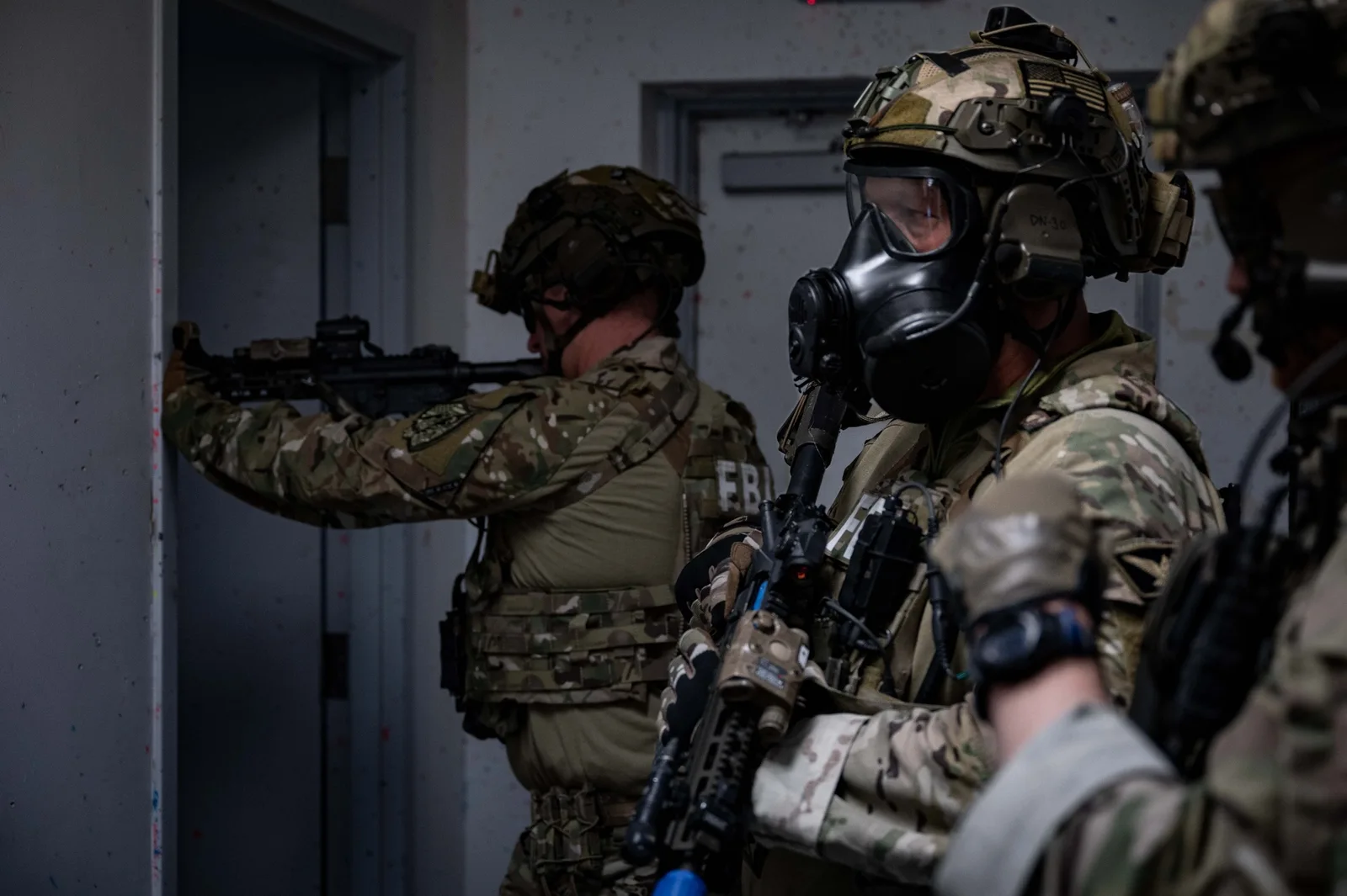 Federal law enforcement agents conducting an official operational briefing.