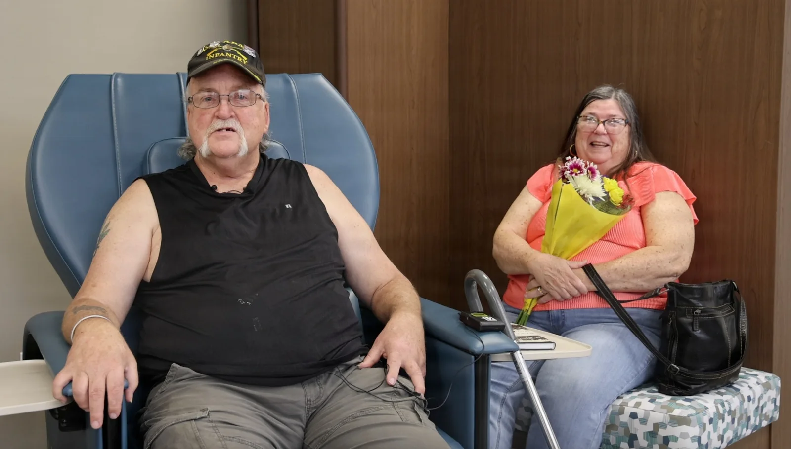 A VA health care provider assisting a veteran patient.