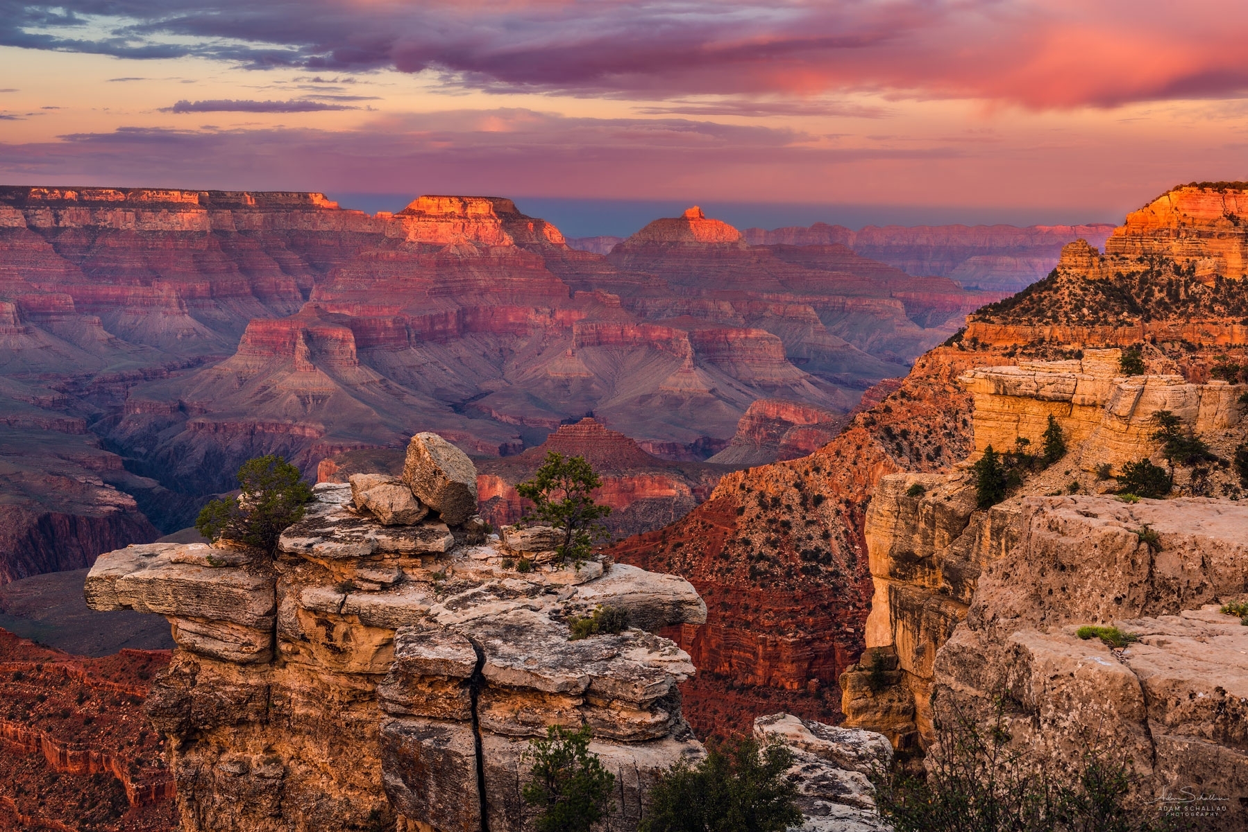 Sunrise lighting up the layered rock formations of the Grand Canyon's South Rim, Arizona