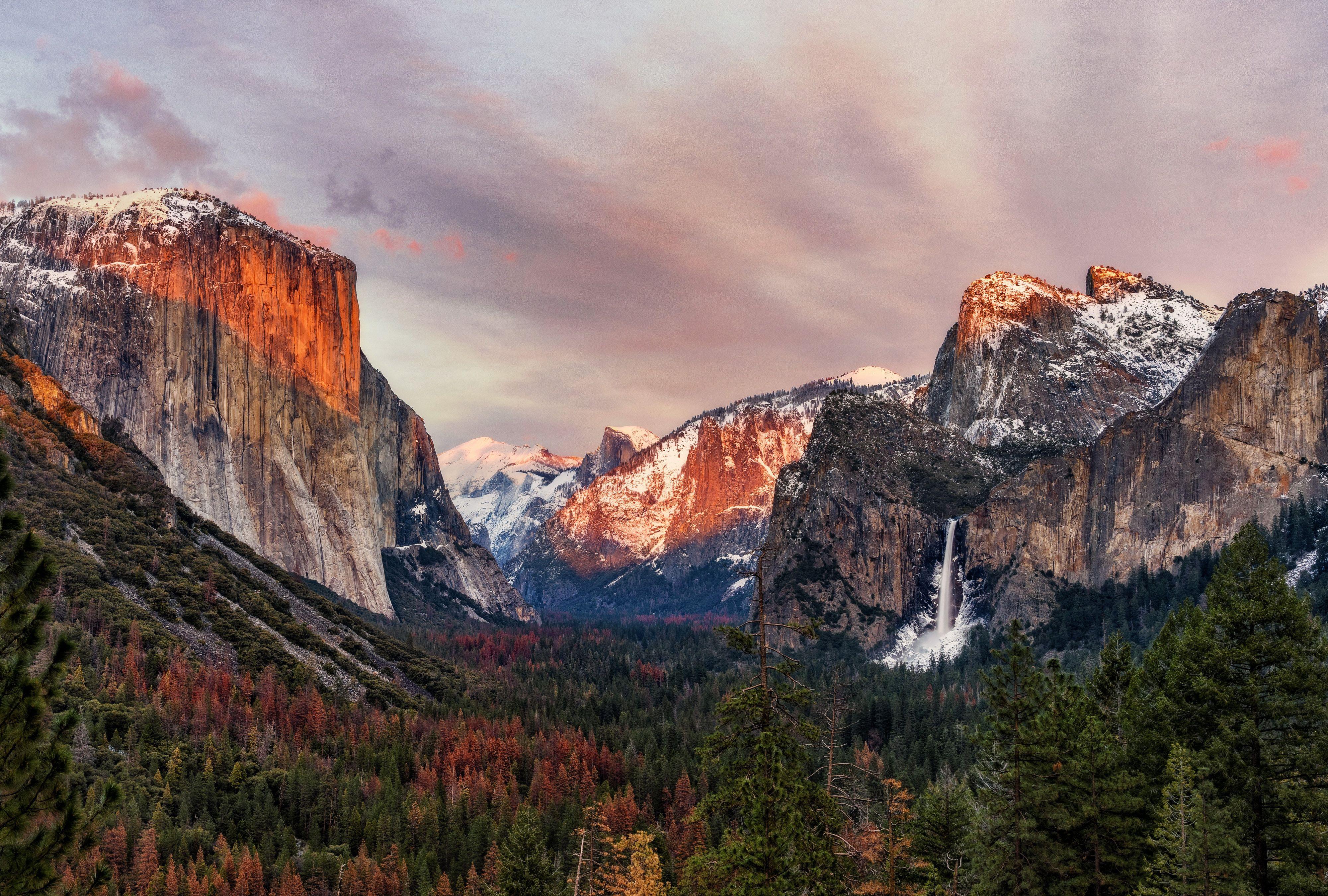 Yosemite Valley with El Capitan and Half Dome reflected in the still waters of the Merced River