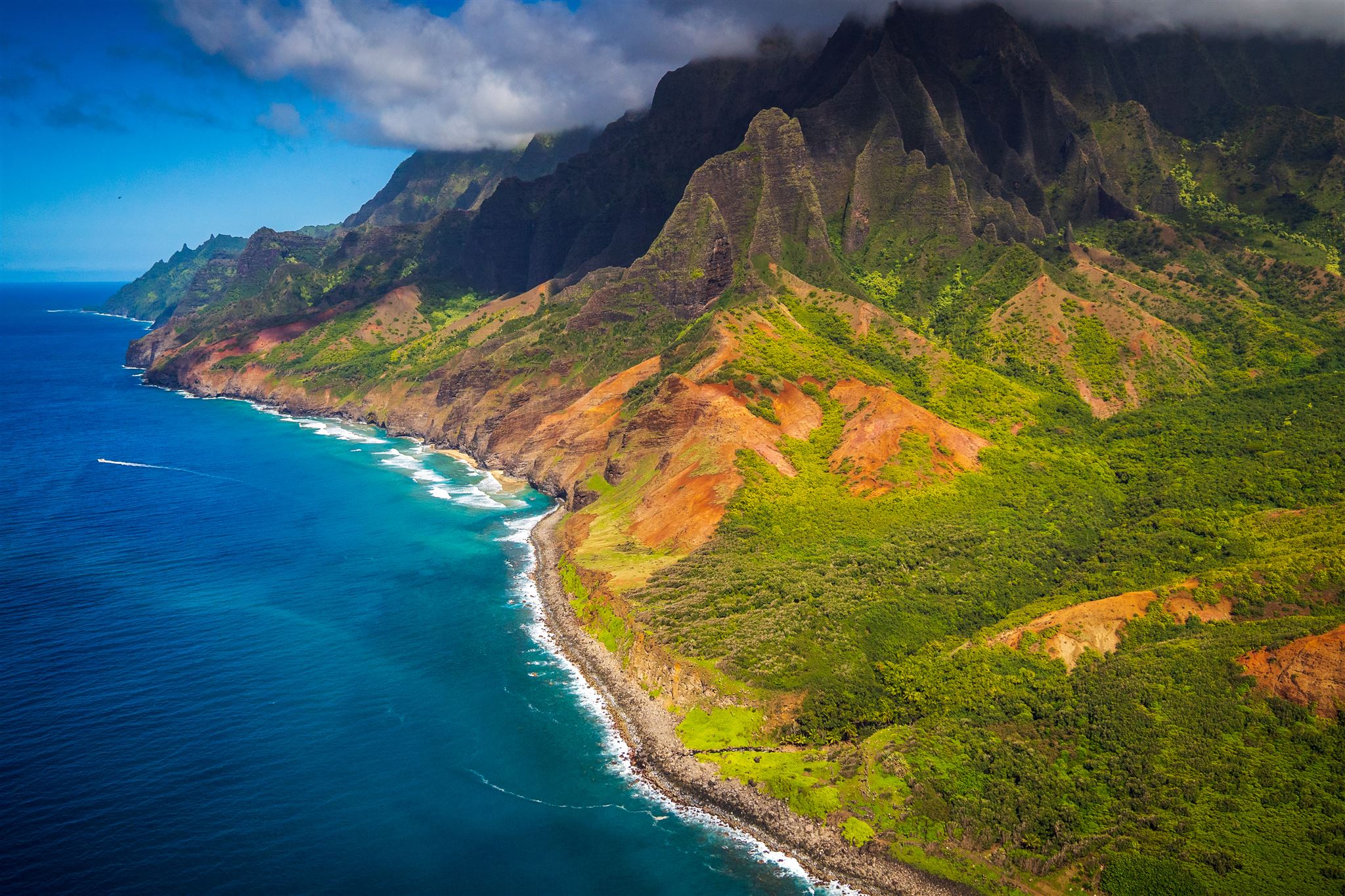 Dramatic sea cliffs of the Na Pali Coast rising above the Pacific Ocean, Kauai, Hawaii